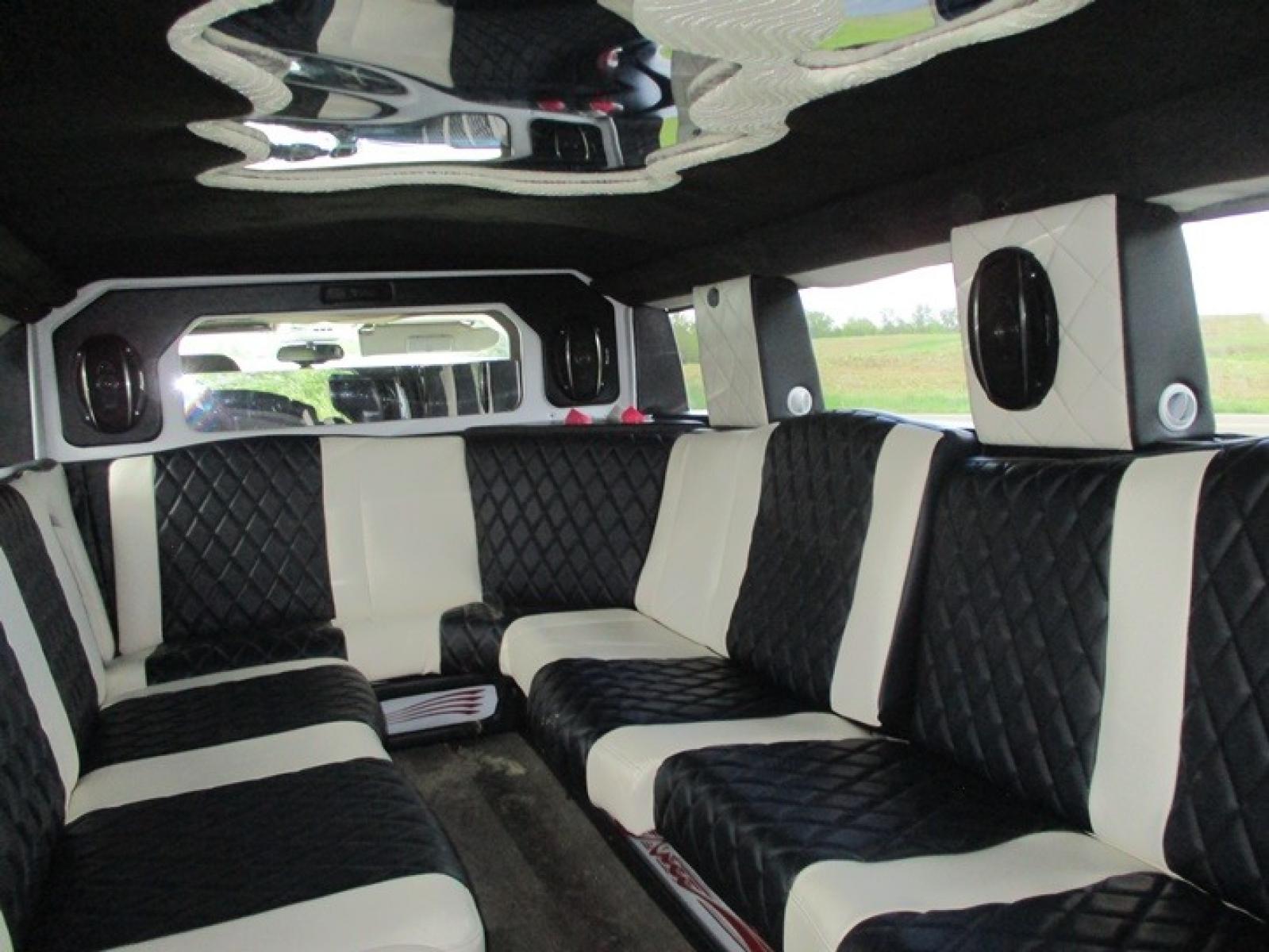 2005 White /White/Black Hummer H2 , located at 1725 US-68 N, Bellefontaine, OH, 43311, (937) 592-5466, 40.387783, -83.752388 - 2005 Hummer H2 175" SUV VIP Limousine, White w/White/black leather interior, Front/Rear Ait, Flat Screens, AM/FM/CD reconditioned Interior, LOADED - Photo #4